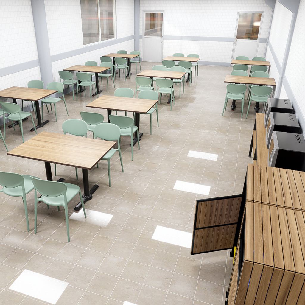 Comedor industrial diseñado para empresas corporativas, con mobiliario funcional y ambiente higiénico.